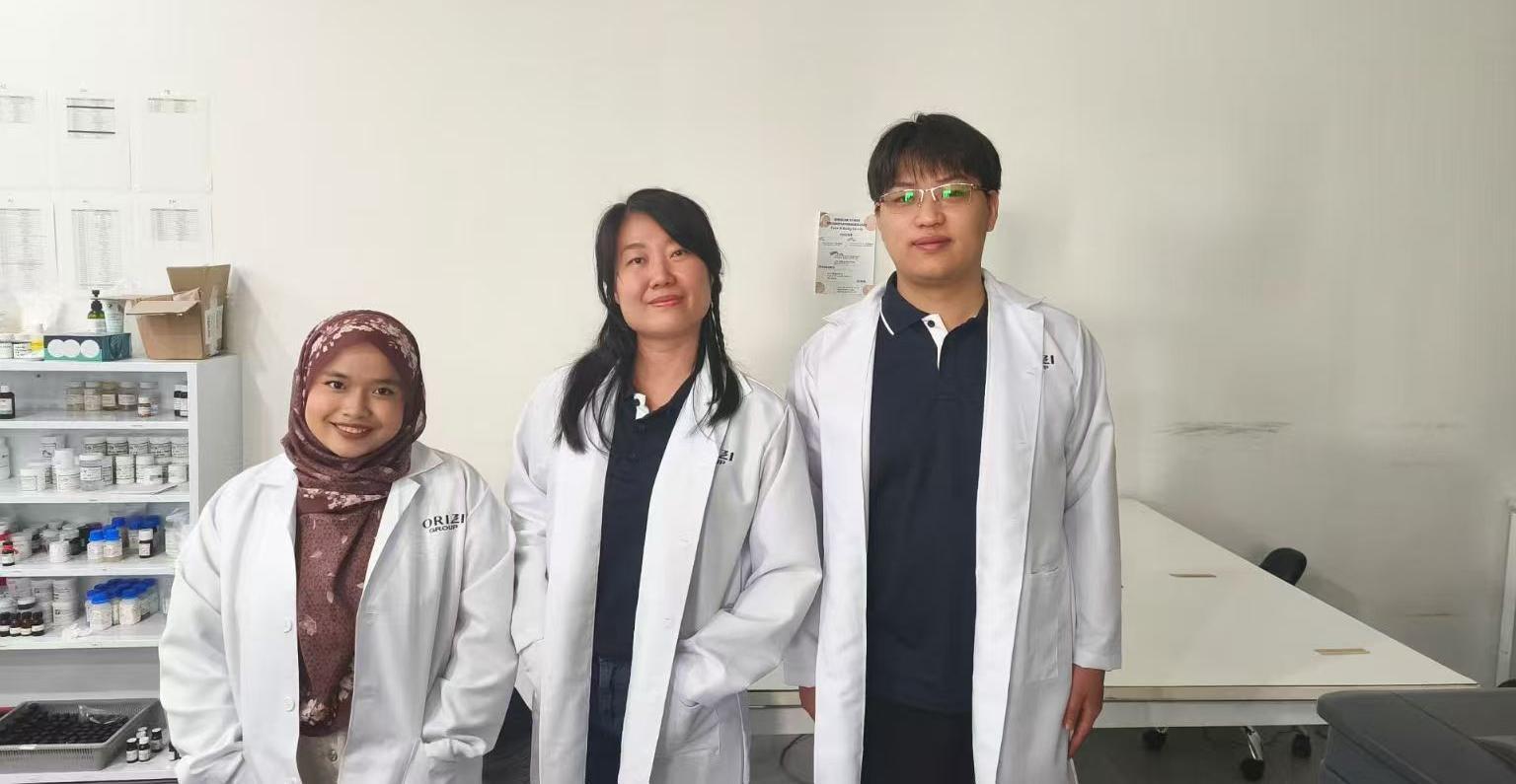 Jancer local R&D team members in laboratory coats